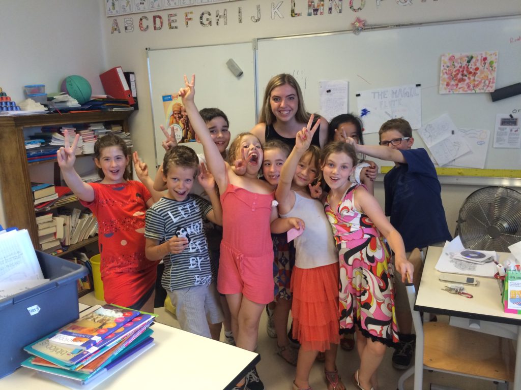 Syracuse student with schoolchildren