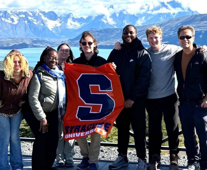 Students holding SU flag in Chile